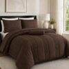Five-piece queen size quilt set in brown for a cozy bedroom aesthetic.