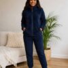 Womens cozy fleece lounge set featuring a zip-up jacket and matching pants.