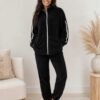 Womens cozy fleece lounge set featuring a zip-up jacket and matching pants.