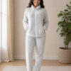 Womens cozy fleece lounge set featuring a zip-up jacket and matching comfortable pants.